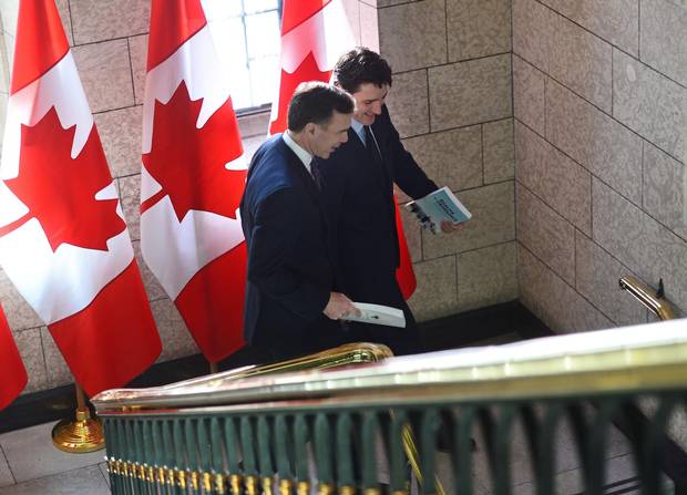 Finance Minister Bill Morneau, left, and Prime Minister Justin Trudeau leave the Prime Minister's Office to table the federal budget in the House of Commons in Ottawa on Tuesday, Feb.27.