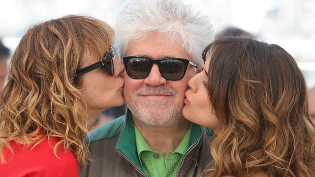 Pedro Almodovar, seen receiving kisses from Julieta actors Emma Suarez, left, and Adriana Ugarte, right, has written Alice Munro a long letter of appreciation, which he still hasn’t sent because he is afraid of bothering her.