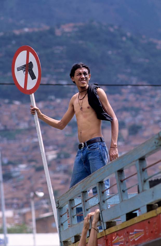 Protestor against small arms during a peace demonstration in the Colombian city of Medellin, Antioquia, 2002. The International Action Network on Small Arms (IANSA), a global movement against gun violence estimate that 300,000 to half a million people around the world are killed by small arms each year. 