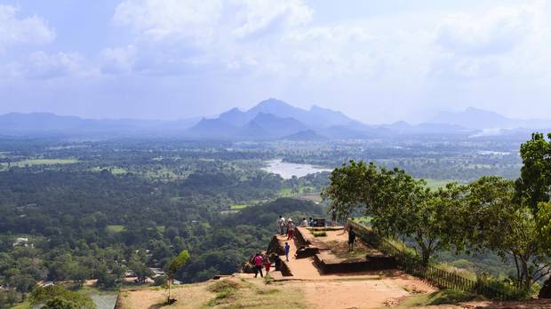 Tourists take in the view from the top of Sigiriya rock in Sri Lanka.