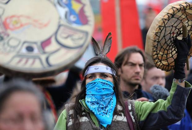 First Nations protester Ceci Point of the Musqueam Band marches against the proposed expansion of Kinder Morgan's Trans Mountain Pipeline in Vancouver, B.C. on Nov. 19, 2016.
