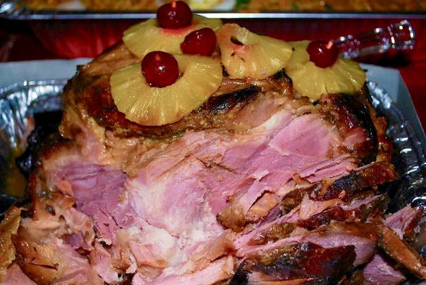 photos from Carol Gomez and her family's holiday traditions.- The Christmas hamón, a sweet and salty ham glzed with brown sugar and pineapple juice, one of Carol’s favourite traditional dishes for Noche Buena.