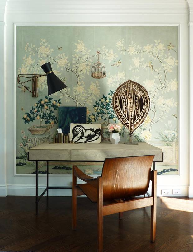 Calgary interior designer Nam Dang-Mitchell's desk features an African shield from Lisbon, flea-market keepsakes from New York and a Danish mid-century chair bought while in Toronto.