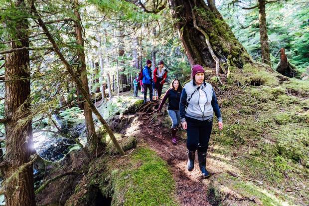 Cyndi Peal and other Canada C3 voyagers explore the moss-covered forests of Gwaii Haanas National Park Reserve and Haida Heritage Site. The Haida share authority over the site with Parks Canada, though not always enthusiastically.