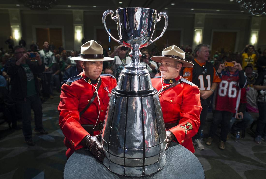 The Grey Cup is marched at the start of Fan State of the League with CFL Commissioner Mark Cohon in Vancouver November 28, 2014. (John Lehmann/The Globe and Mail)