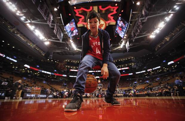 Toronto, Ontario - January 25, 2016 -- Tiago Scola -- Tiago Scola, 10 year old son of Toronto Raptors player Luis Scola, poses in front of the the Raptors dressing room before they play the L.A. Clippers at the Air Canada Centre in Toronto, Monday January 25, 2016