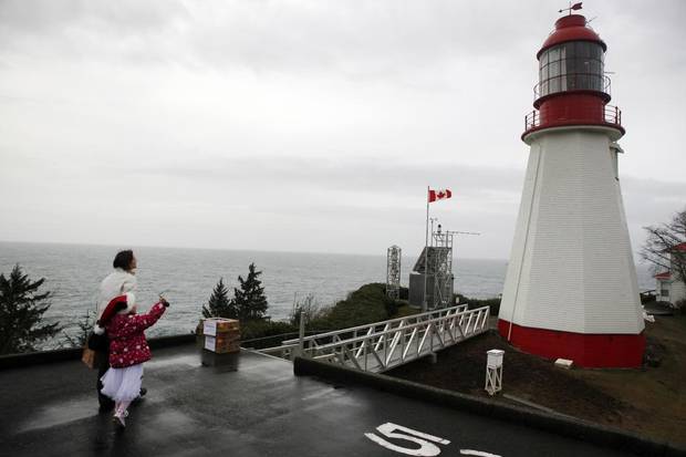 Tamara Martin and her daughter Sammy, 7, on the landing pad at Pachena Point Lighthouse, south of Bamfield, B.C.