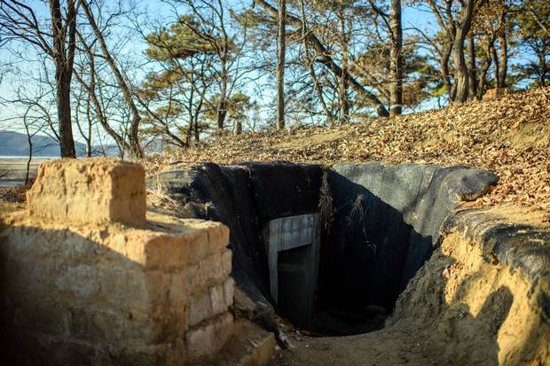 A bunker is built into an operational trench system overlooking the main highway leading toward North Korea near the DMZ.