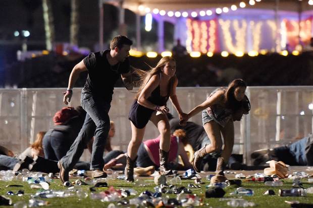 People run from the Route 91 Harvest country music festival in Las Vegas on Oct. 1, 2017, after gunfire broke out.