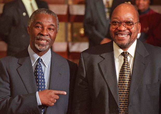 Former South African president Thabo Mbeki, left, shares a laugh with his then-deputy president in Cape Town, South Africa, in June, 1999.