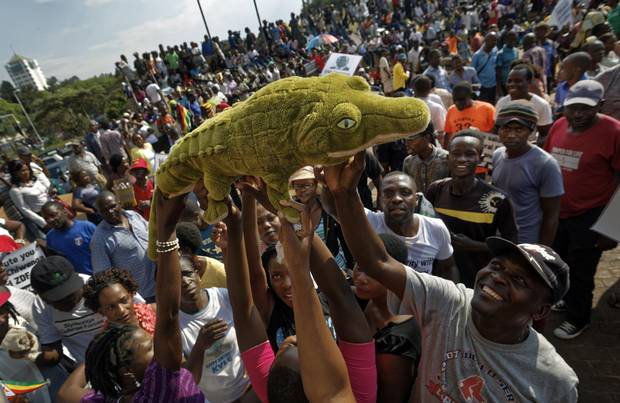 Supporters of Zimbabwe's incoming president Emmerson Mnangagwa, known as ‘The Crocodile,’ await his arrival at the Zanu-PF party headquarters in Harare on Nov. 22, 2017.