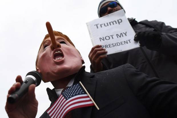 Jan. 20, 2017: Demonstrators in Washington gather to protest against the inauguration. Mr. Trump’s attacks on the media and “fake news” have driven, or at least coincidede, with an alarming collapse of trust in the press.