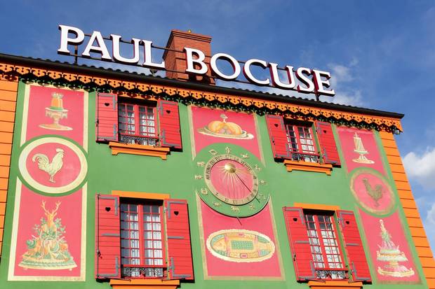 Lyon, France - September 25, 2015: Facade of the restaurant Paul Bocuse. Paul Bocuse, 3 stars at the Michelin guide, is a french chef based in Lyon who is famous for the high quality of his restaurant.