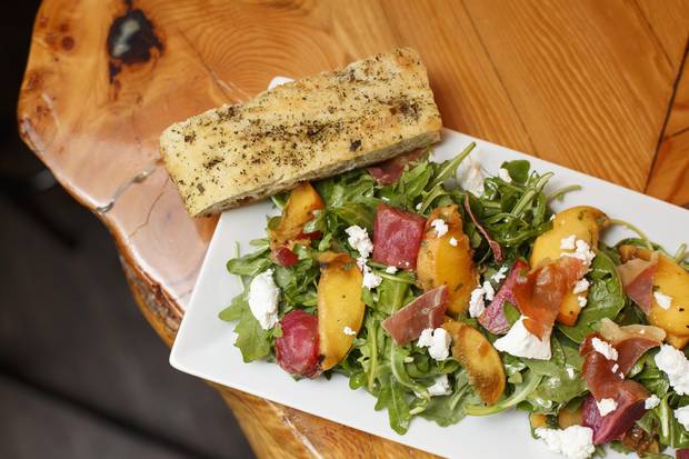 Cilantro and Chive in Lacombe has a knack for salads, including this one, topped with grilled peach and proscuitto.