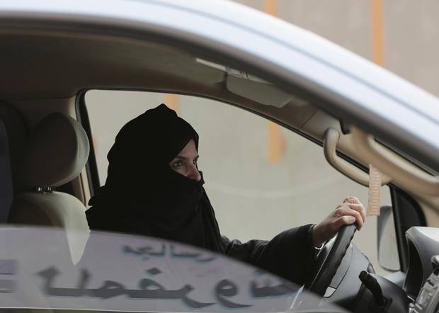In this Saturday, March 29, 2014 file photo, Aziza Yousef drives a car on a highway in Riyadh, Saudi Arabia, as part of a campaign to defy Saudi Arabia's ban on women driving.