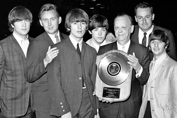 The Beatles pose with executives from Capitol Records backstage at Maple Leaf Gardens in Toronto in September, 1964. From left: John Lennon, Paul White, George Harrison, Paul McCartney, Geoffrey Racine (holding an award), Taylor Campbell and Ringo Starr. Mr. White designed and compiled several Canadian-only albums by the Fab Four.