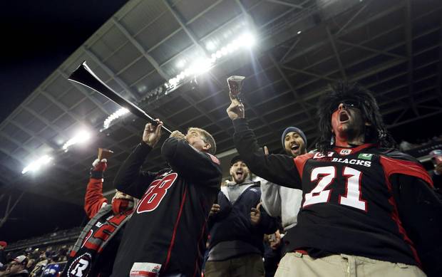 Ottawa Redblacks fans cheer from the stands before the Canadian Football League's 104th Grey Cup championship game in Toronto on Nov. 27, 2016.