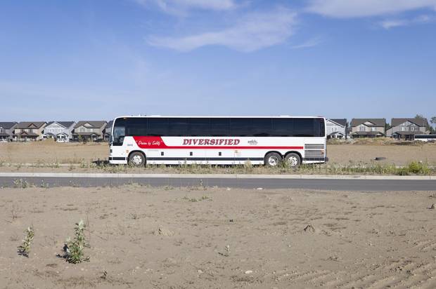 A charter bus to take workers to and from oil sands sites in the Parsons Creek subdivision in Fort McMurray.