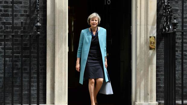This file photo taken on June 27, 2016 shows British Home Secretary Theresa May walking through the door of 10 Downing Street after attending a cabinet meeting.