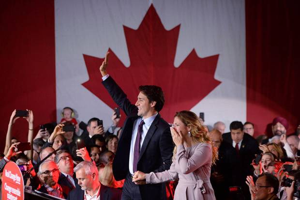 Justin Trudeau makes his way to the stage with wife Sophie Grégoire Trudeau at Liberal Party headquarters in Montreal on Oct. 20, 2015, the day after the Liberals swept to power in the federal election.
