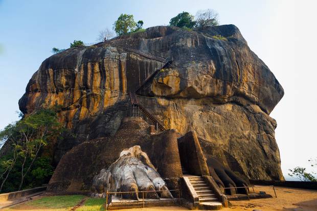 The second level stairs and entrance to the former fortress and monastery of Sigiriya, guarded by a pair of lion paws.
