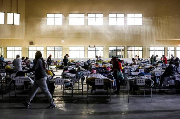Evacuees from the wildfires use the sleeping room at the 