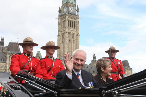 Oct. 1, 2010: Mr. Johnston waves as he leaves Parliament Hill with his wife following his installation ceremony.