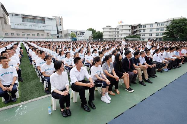 High school students attend the opening ceremony of a new term at their school in Beijing in September, 2016. 
