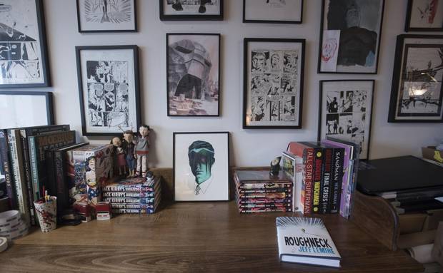 The walls of Jeff Lemire's Toronto studio are covered with artwork from other graphic novelists.