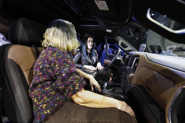 Members of the media examine the interior of he new 2019 Chevrolet Silverado 1500.
