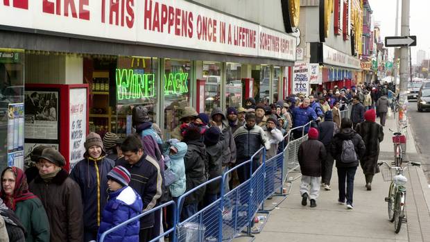 At Honest Ed's Annual Christmas Free Christmas Turkey giveaway on Nov. 24, 2002, People lined up along Bloor Street waiting to get into the store for the free handouts of turkeys and fruitcakes.