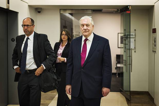 Mr. Waitzer, left, with Conrad Black, leaving an OSC hearing in 2014.
