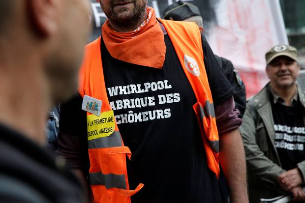 A Whirpool union employee sports a T-shirt accusing the company of manufacturing the unemployed.