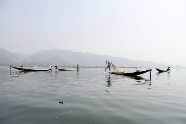 Inle Lake's famed traditional fisherman look for a catch in the late afternoon.