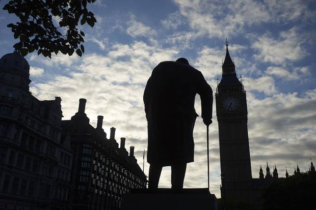 The statue of Winston Churchill faces Big Ben and the Houses of Parliament in central London.