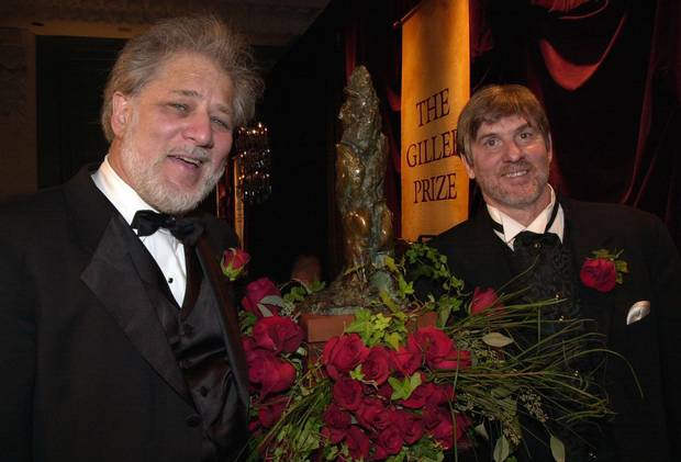 Michael Ondaatje, left, and David Adams Richards, co-winners of the 2000 Giller Prize, pose during a ceremony in Toronto.