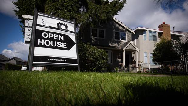 An open house sign is seen in front of a home listed for sale for $1.725-million in the neighbourhood of Arbutus, in Vancouver, B.C., on Saturday April 25, 2015.