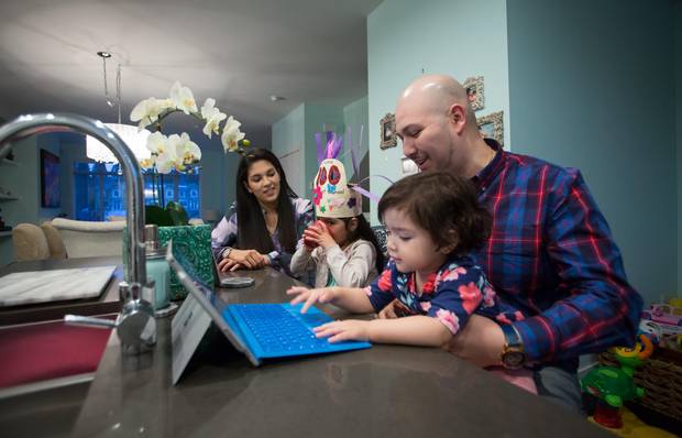 David Llonuc and his family relax in their home in Surrey, B.C.