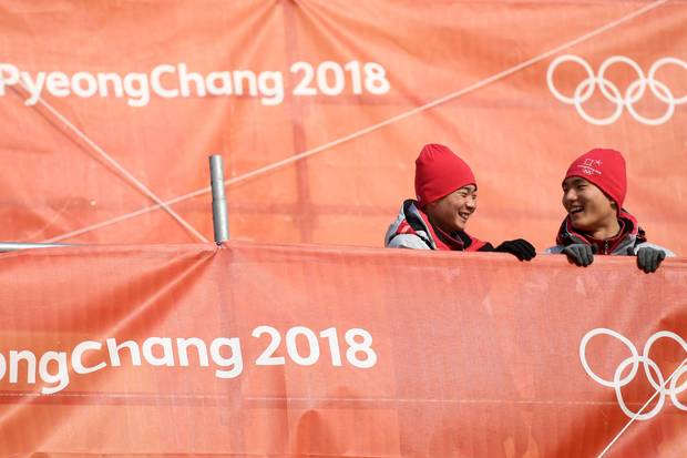 Volunteers attend the men's slalom event at the Yongpyong Alpine Centre on Feb. 22, 2018 in Pyeongchang.