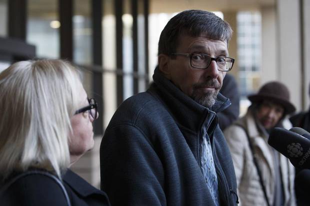 Bret McCann, flanked by his wife, Mary-Ann McCann, left, speaks to the media after giving a victim-impact statement during Travis Vader's sentencing hearing.
