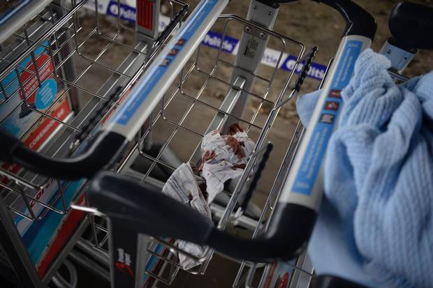A blood-soaked towel lies in the basket of a luggage trolley at Brussels Airport in Zaventem, day after triple bomb attacks in the Belgian capital.