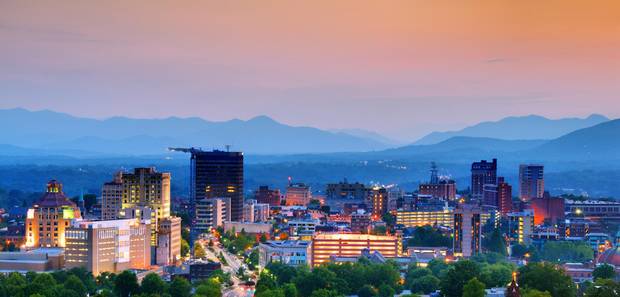 Asheville, North Carolina's skyline is nestled in the Blue Ridge Mountains.