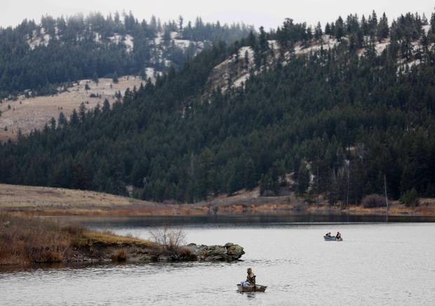 Boaters fish for trout on Jacko Lake, near the site of a proposed expansion of Kinder Morgan's Trans Mountain pipeline.