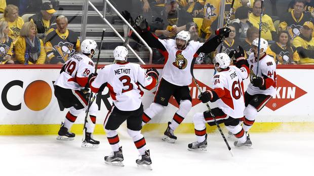 The Ottawa Senators celebrate Bobby Ryan's overtime winner in Game 1 of their third-round series against the Penguins in Pittsburgh Saturday.