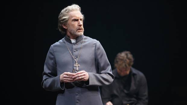 Directed by Antoni Cimolino and Shelagh OBrien. Credit: Stratford Festival. Tom Rooney as Polonius with Jonathan Goad, background, as Hamlet in Hamlet.