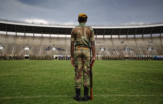 A Zimbabwean soldier stands to attention during a dress rehearsal ahead of Friday's presidential inauguration of Emmerson Mnangagwa at the national stadium in Harare on Nov. 23, 2017.
