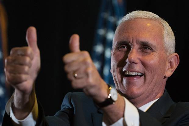 Indiana Governor Mike Pence gestures during a campaign stop in Gettysburg, Pa., on Oct. 6, 2016.