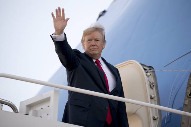 President Donald Trump waves as he boards Air Force One at Andrews Air Force Base, Md., Friday, Nov. 3, 2017, to travel to Joint Base Pearl Harbor Hickam, in Hawaii. 