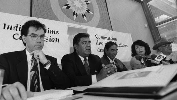 Jim Prentice, left, then a land-claims commissioner, attends a 1993 news conference in Saskatoon with indigenous leaders from the Canoe Lake First Nation.