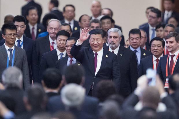 China's President Xi Jinping, centre, arrives with leaders at the Great Hall of the People on Dec. 1, 2017.
